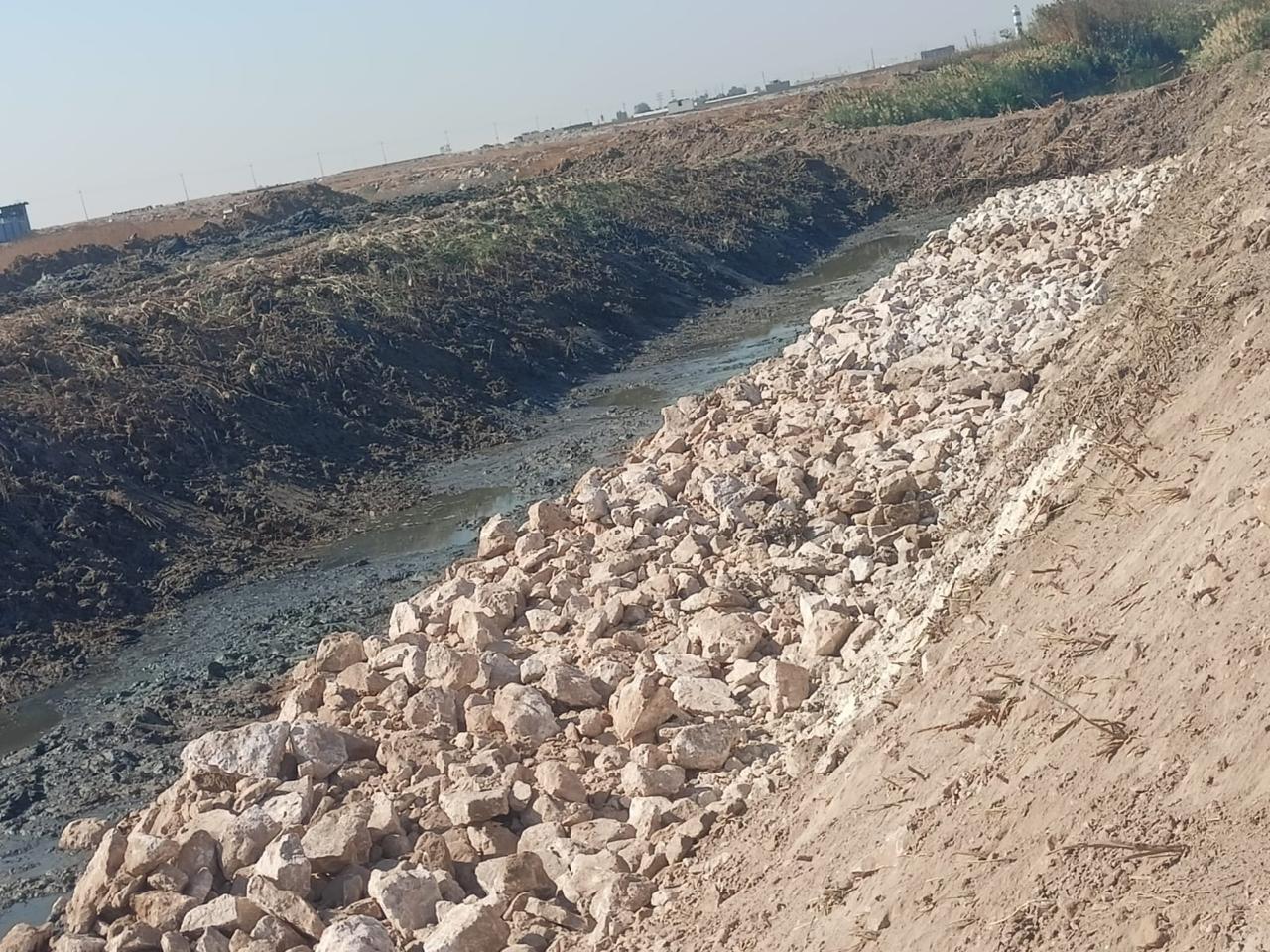 Rock protection along the bank of an open drainage canal